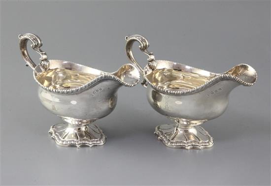 A pair of George III silver pedestal sauceboats by William Skeen, 29.5 oz.